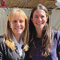 Elana Silber, Sharsheret’s chief executive officer, and Jordana Altman, its director of marketing and communications, also were at the lunch in the Holy Name sukkah. (Jeff Rhode)