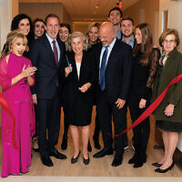 Marilyn Taub cuts the ribbon to the Taub Family Rehabilitation Residence. She is flanked by Taub family members, Carol Silver Elliott, left, and Carol K. Silberstein, right. Marilyn Taub cuts the ribbon to the Taub Family Rehabilitation Residence. She is flanked by Taub family members, Carol Silver Elliott, left, and Carol K. Silberstein, right.