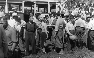 Jewish refugees get off a bus in Sosua in 1940, seeing their new home for the first time. (Photos courtesy Fish Center at Yeshiva University)