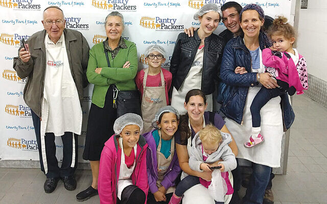 Back row: Albert and Sarah Allen of Englewood and Uriel, Mayan, Al, Aviva, and Avital Efremoff of Jerusalem. Front row: family friend Hodaya, Dalia Efremoff, and Elana and Liel Amminadav of Jerusalem at Pantry Packers in 2015.