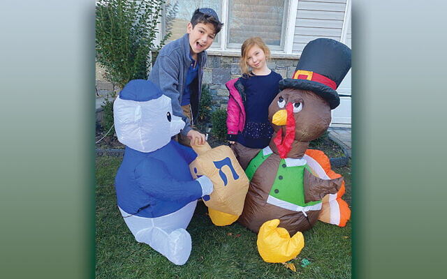 Rafi and Rifka Samuel, the children of Penny and Yoel Samuel, helped decorate the front of their Bergenfield home in time for Thanksgiving and Chanukah.