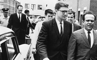 Rabbi Martin Freedman, right, and Rabbi Israel Dresner, center, are taken to the Tallahassee city building where they were charged with unlawful assembly. The two of them and 10 other Freedom Riders were arrested as they attempted to eat at the Tallahassee airport in June 1961. (Getty Photos)