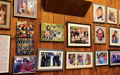 Ms. Bieler’s wall is covered in knotty pine and many photographs. The wood has to go.