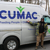 A driver from Cumac picks up donations for their group.