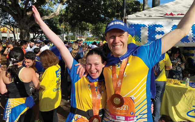 Kira and Dr. Nathan Fox after finishing the half marathon in Miami for Team Lifeline.