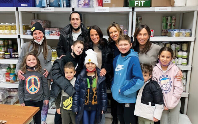 Several families went to JFCS in Teaneck to stock the shelves.