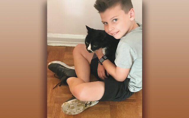 Cory Silverstein and his Nana’s pet cat, Tiki.