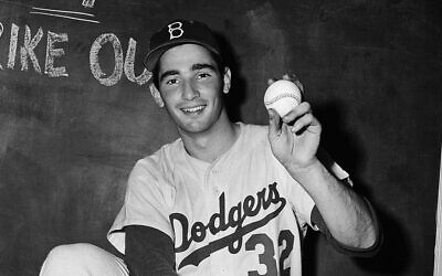 Sandy Koufax grins after striking out 14 batters in a game in 1955. (Bettmann/Getty Images)