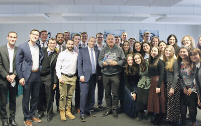 The two men in the center of the group of YU students are Rabbi Ari Berman, in a suit, and Austrian politician Wolfgang Sobotka, in a YU sweatshirt.