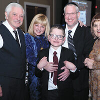 Yoel Feder, star of the evening’s featured documentary “In the Blink of an Eye,” with his proud parents, Michelle and Avi Feder, and his grandparents, Linda and Robert Kinzelberg.
