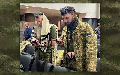 Asher, left, and David Cherkaskyi pray in their Dnipro, Ukraine, synagogue this week. The father and son have enlisted to fight for Ukraine in its war against Russia. (Courtesy David Cherkaskyi)