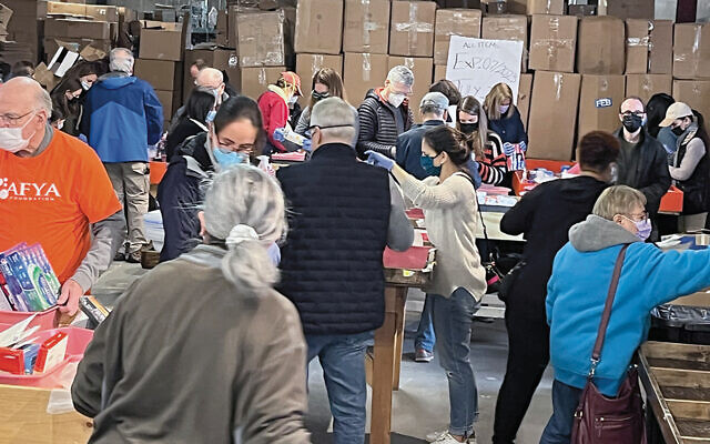 On Sunday, Lois Goldrich and her son Yaron went to Yonkers to help pack supplies for Ukraine. (N.Y. UJA Federation/Afya)