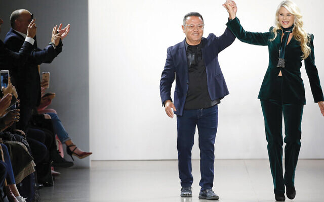 In a still from the movie, Elie Tahari and Christie Brinkley enter the room in triumph. In a still from the movie, Elie Tahari and Christie Brinkley enter the room in triumph.