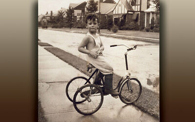 Jonathan Lazarus prepares to pilot his tricycle in front of the family home in Flushing circa 1945.