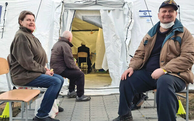 Patients wait outside the Shining Star Israeli field hospital in Ukraine.