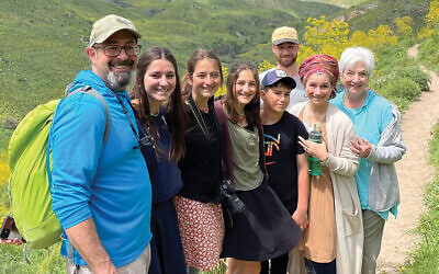 Tzivia Bieler, right, is next to her daughter, Lara Kwalbrun. From left, she’s with her son-in-law, Dr. Mark Kwalbrun, and some of the Kwalbruns’ kids — Estair, Tselya, Hadar, Chaki, and Raanan.