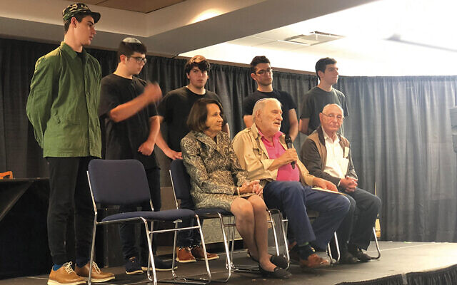 Students and Holocaust survivors during presentation of “Bare Witness 2022”