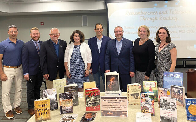 From left, Tony Donato, a member of the Wyckoff public library’s board of trustees; Rev. Andy Kadzban of the Wyckoff Reformed Church; Wyckoff’s Mayor Rudy Boonstra; Steve and Denise Liz Reingold and Michael Frenkel, son and daughter of Steve and Denise Frenkel; Rabbi Joshua Waxman, Temple Beth Rishon, Wyckoff; Peggy Chagares, Wyckoff Library board chair; and Laura Leonard, Wyckoff Library’s executive director.
