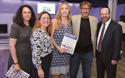 Art show sponsors Diane Lempert and Joseph Sprung, the executive director and the chairman and founder of Bear Givers, third and fourth from left, are flanked, from left, by Sinai’s development director, Pam Ennis; the school’s communications director, Abigail Hepner Gross; and the school’s dean, Rabbi Dr. Yisrael Rothwachs.
