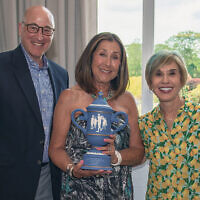 Peter Martin and Carol Silver Elliott, the Jewish Home Family’s president and CEO, flank honoree Beth Shiffman.
