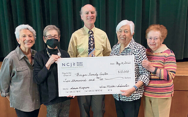 Mitch Schonfeld, president/CEO of the Bergen Family Center, receives a check from NCJW board members Ina Miller-Silverstein, Doris Sarokin, Aida Melamed, and Evalyn Brownstein.  (Courtesy NCJW)