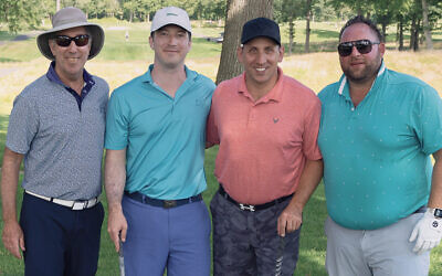 Chuck Casser, left, with John Meyer, Matthew Mazon, and Josh Chananie, a golf foursome at last year’s “Play Fore 
the Kids!” (Courtesy JCCOTP)