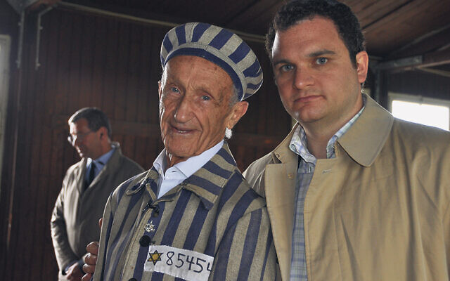 Edward Mosberg sometimes put on a recreation of his concentration camp uniform as he told his story. Here he and his grandson Barry Levine stand together at Mauthausen in 2015. (All photos courtesy the Mosberg Family)