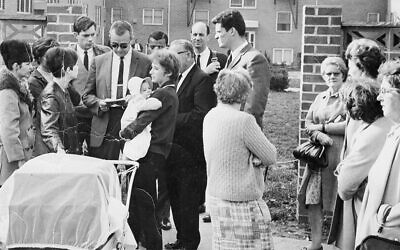 Jonathan E. Lazarus — the tall young man with the luxuriant hair in the center of the photo — covers a tenants’ strike in East Paterson in 1964. He was a reporter for the Record of Hackensack.