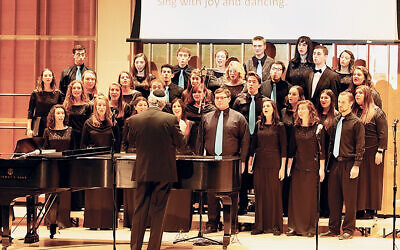 Matthew Lazar conducts Zamir Noded, a chorus for young adults, in 2019.