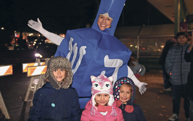 Marina Krasnapolosky is in the dreidel costume at a previous Glen Rock Chanukah ceremony.