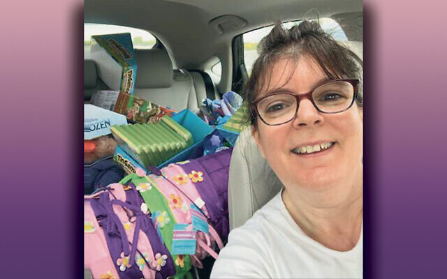 Barbara Blumberg of Teaneck has her car packed with donations.