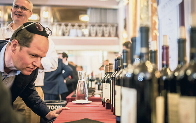 A visitor to a recent Kosher Food and Wine Experience checks out some of the offerings.