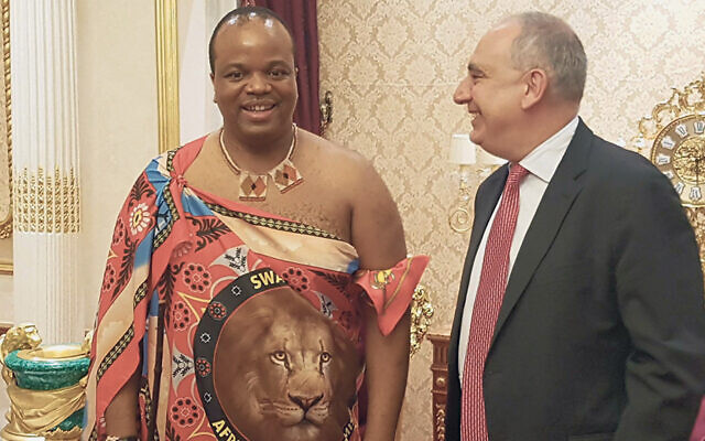 Mr. Lenk stands with King Mswati III of Eswatini. (The country used to be known as Swaziland.)
