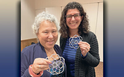 Victoria Schrager, left, and Sara Froikin-Gordon with their creations. (Courtesy GRJC)