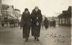 Here, in 1924, Polly, left, strides along the Atlantic City boardwalk with a friend, showing off the new fur she bought herself.