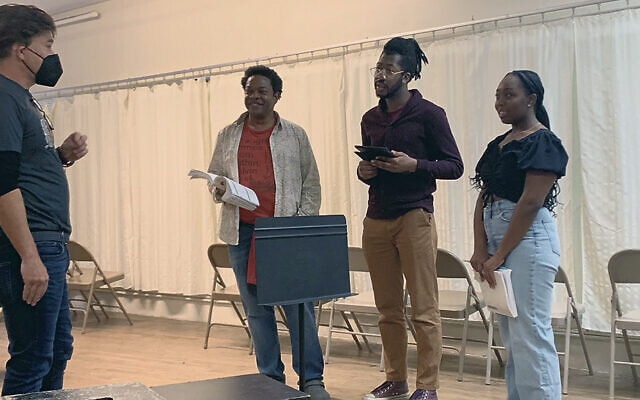 Director Hunter Foster works with C. Mingo Long, RJ Christian, and Amaya White.