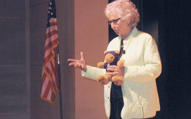 This photo, from 2011, shows Maud Dahme at a Holocaust education program at the College of Saint Elizabeth, shortly after she was presented with a teddy bear, a luxury she never enjoyed as a child. 
(Johanna Ginsberg/New Jersey Jewish News)