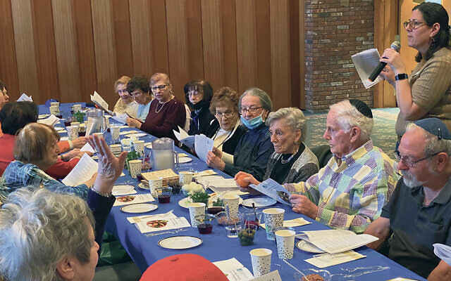 Jennifer Sauer, right, with seder attendees.