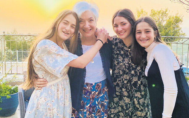 On erev Pesach, just before the sun set over Israel, Tzivia Bieler stands with three of her granddaughters, Tselya, Estair, and Hadar Kwalbrun.