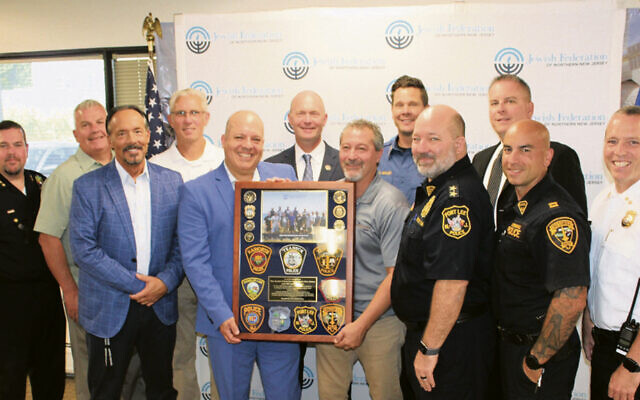Top row from left, Deputy Chief Daniel Sollitti of Jersey City; Chief John Burns of Woodcliff Lake; Deputy Chief Robert DiGenova of Stevens Institute of Technology; Chief Robert Chamberlain of Tenafly; Captain Chad Malloy of Woodcliff Lake; and Chief Michael Gracey of Haworth. Bottom row from left: Timothy Torell, the federation’s director of Jewish community security; Jason Shames, its CEO, Robert Anzilotti, CEO and founder of the Anzilotti Group and retired chief of detectives for the Bergen County prosecutor’s office; Chief Matthew Hintze of Fort Lee; Captain Jason Lanzilotti of Cresskill; and Chief Andrew McGurr of Teaneck. (Courtesy JFNNJ)