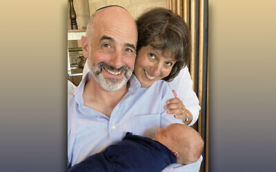 Doron and Janet Krakow cuddle with their newborn grandson.