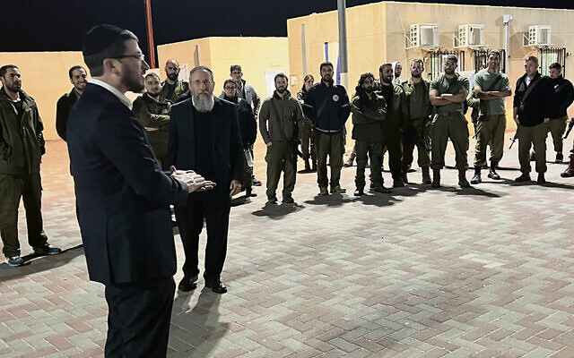 Rabbi Ari Zahtz, left, and Rav Yosef Zvi Rimon talk to IDF troops. (Photos courtesy Rabbi Zahtz)
