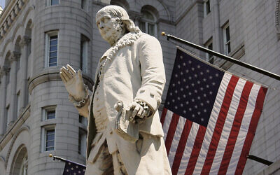 Benjamin Franklin stands in front of the Old Post Office in Washington. (Wikipemedia Commons)