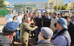 In Israel, Itamar Alus tells his story to American visitors.