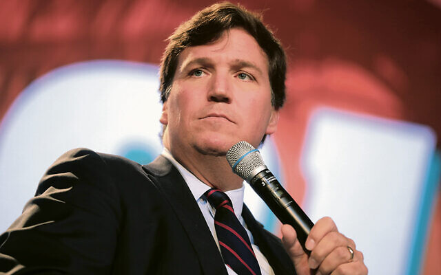 In 2018, Tucker Carlson speaks at a Turning Point USA meeting in Florida.  (Gage Skidmore)