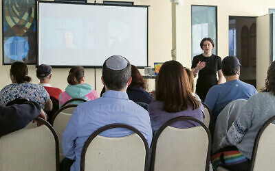 Rabbi Loren Monosov of TEPV introduces the speakers from Israel, who are on Zoom. (Courtesy TEPV)