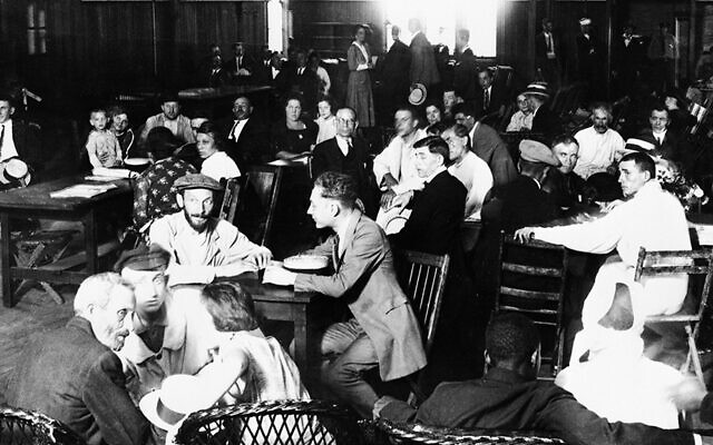 Immigrants waiting for approval of their entry into the U.S. crowd a lunchroom at Ellis Island in 1923. (Bettmann/Getty Images)
