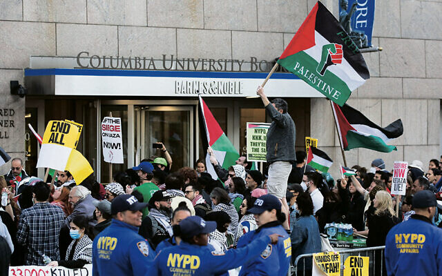 Pro-Palestinian activists protest outside Columbia University  on April 20, 2024. (Leonardo Munoz / AFP)