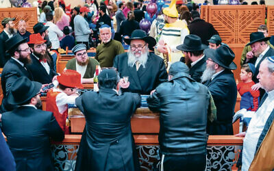Rabbi Mordechai Kanelsky recites havdalah on Purim night.