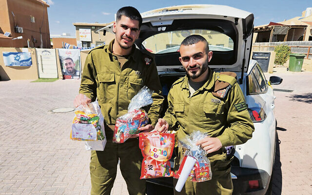 Soldiers receive Purim gift baskets from Meir Panim.